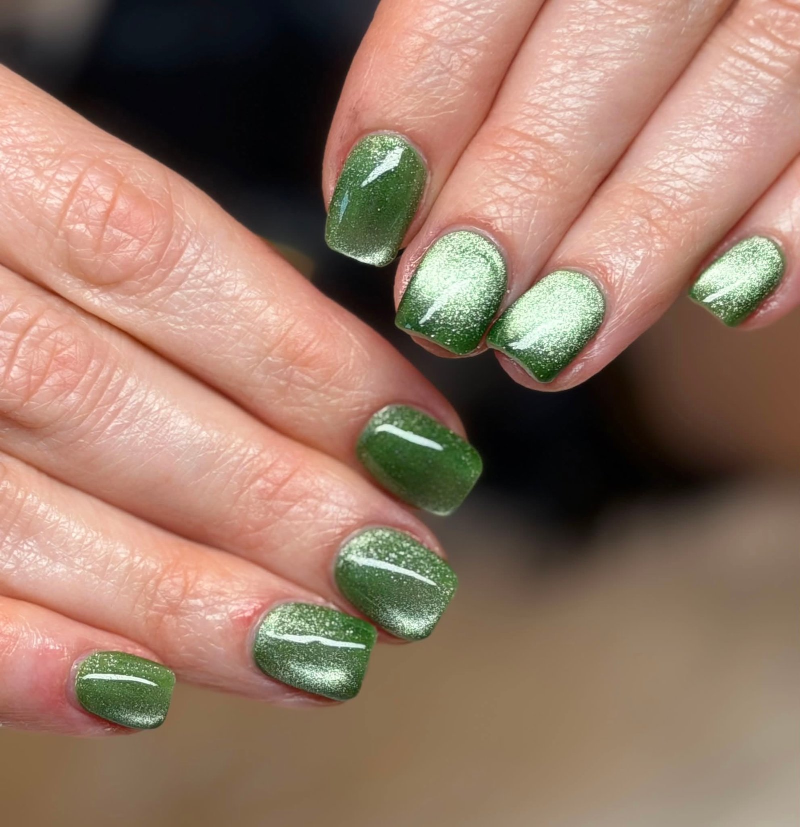 Shimmering olive green manicure