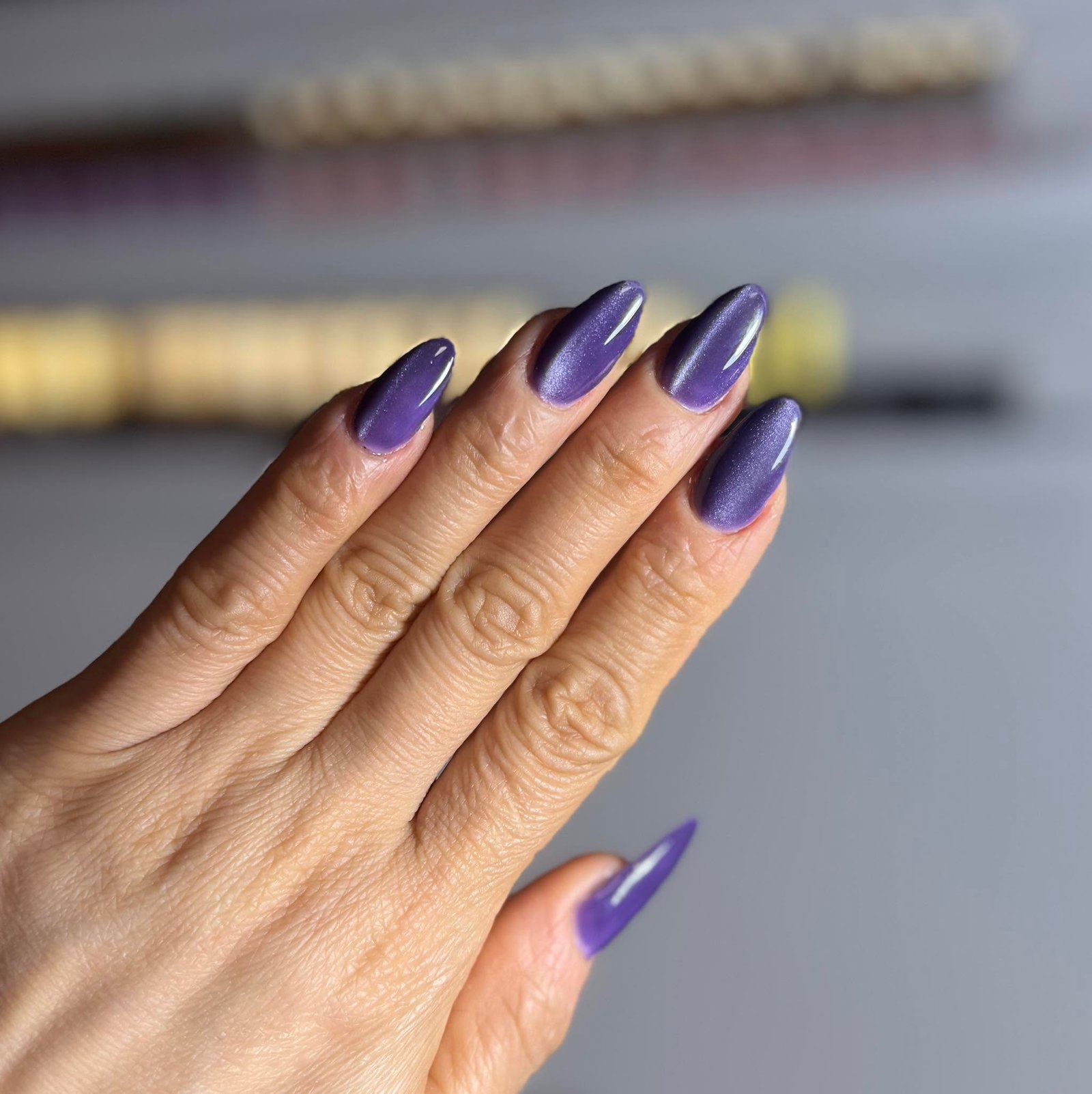 Deep purple shimmer chrome almond nails