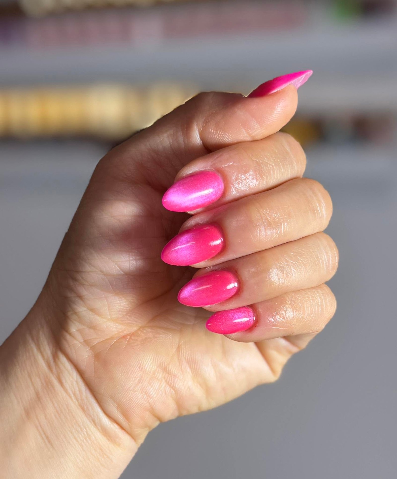 Hot pink shimmer chrome almond nails