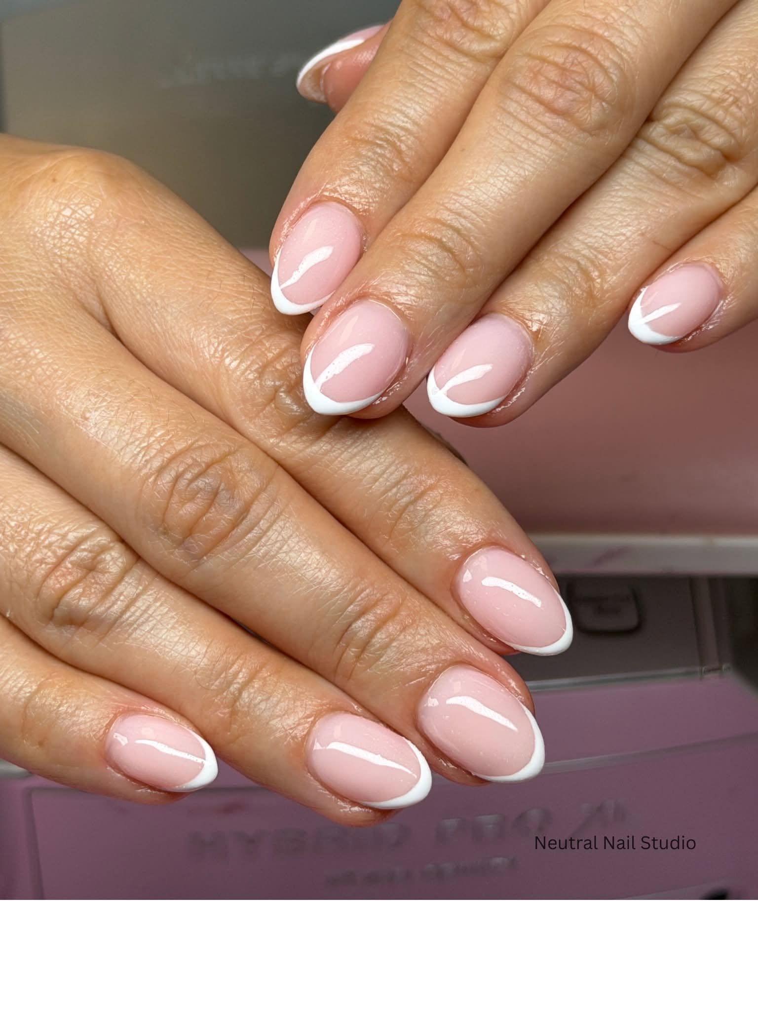 Classic white French tip manicure on natural nails