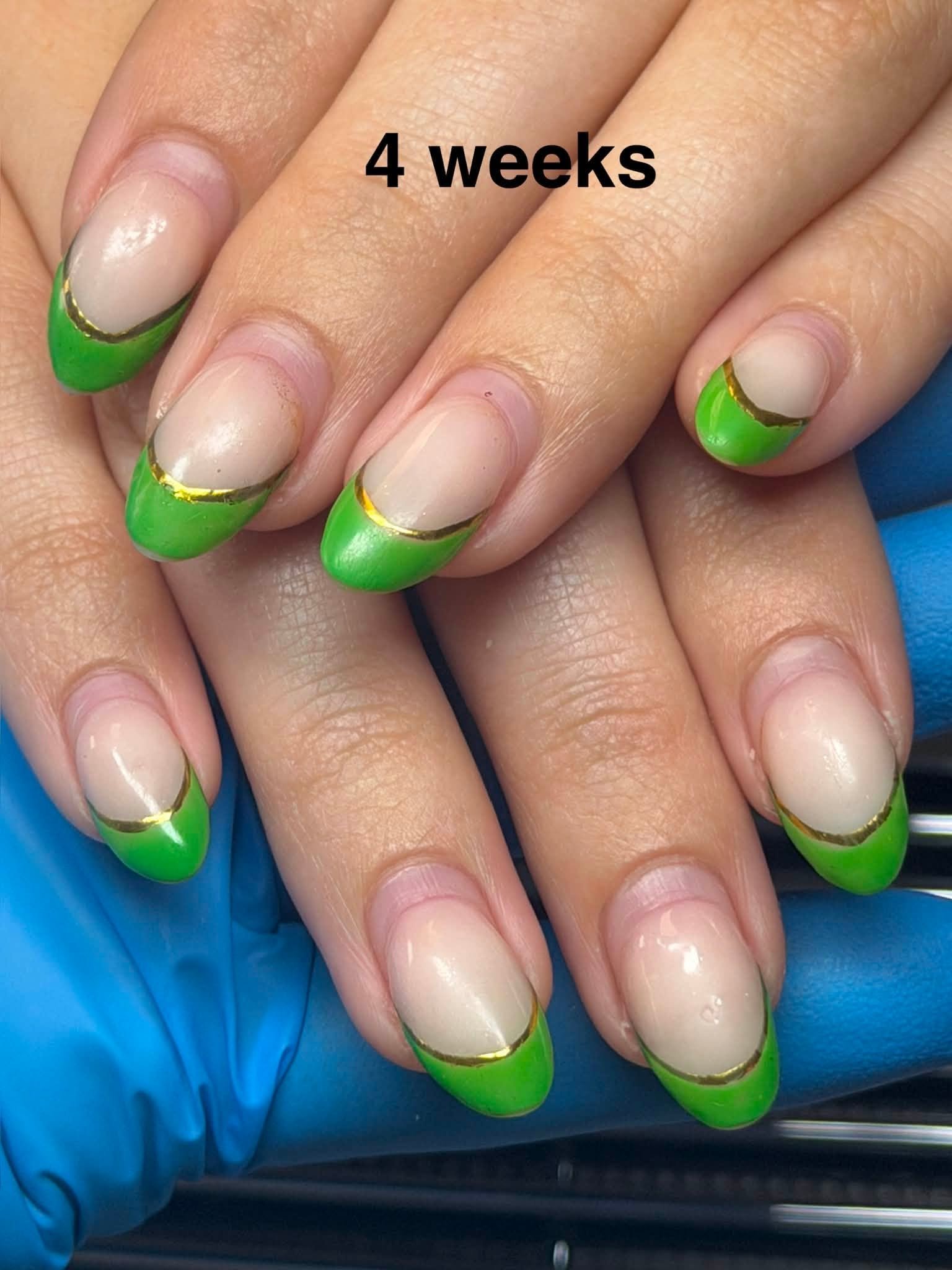 Green French tip nails with a gold outline