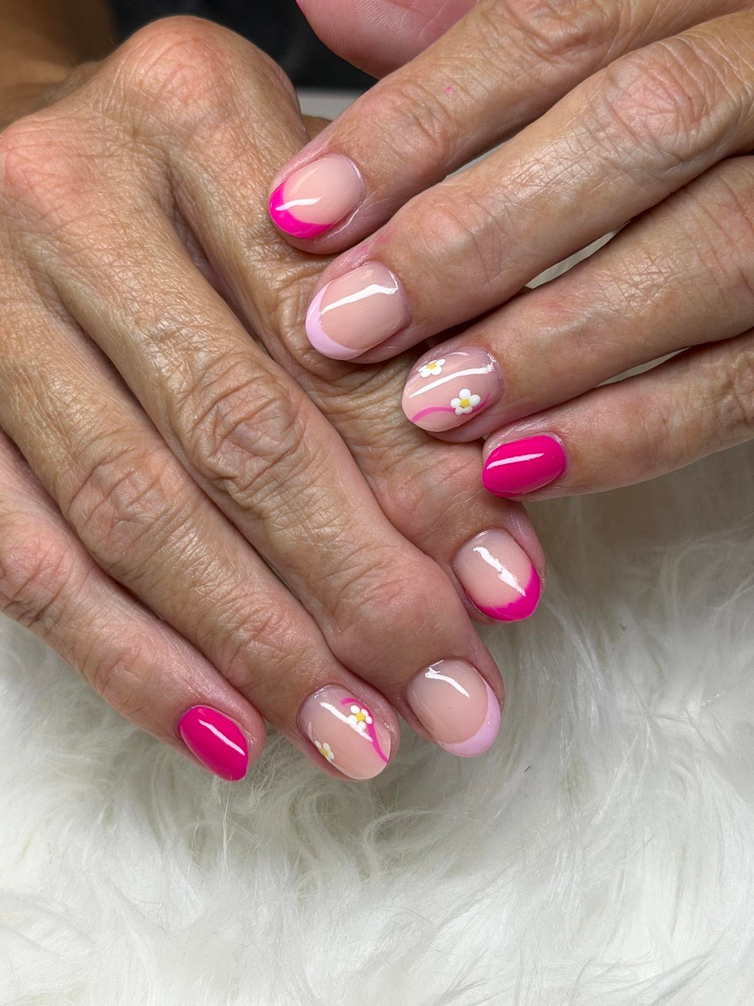 Pink French tips with a delicate daisy accent nail