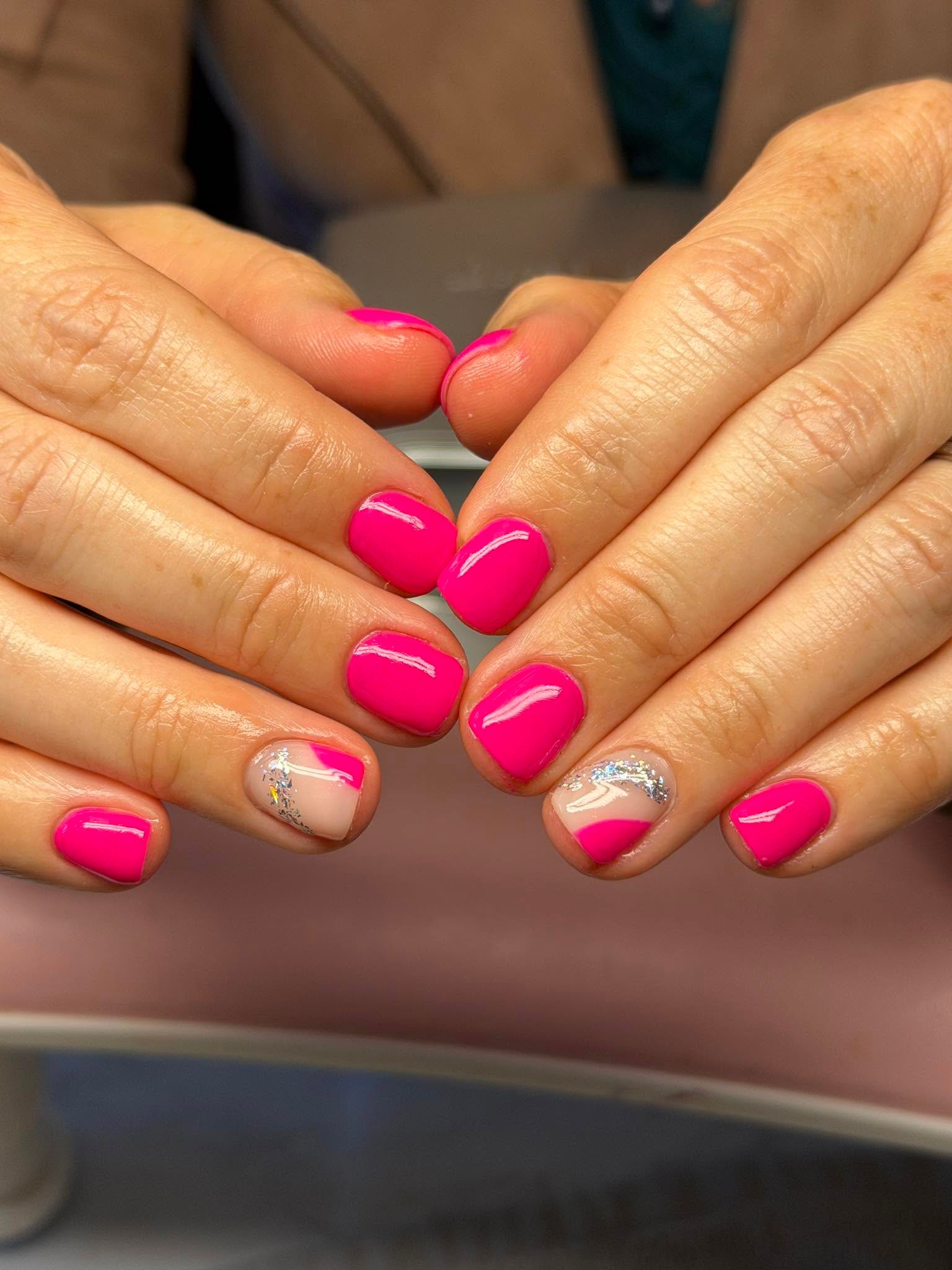 Hot pink gel manicure with two shimmer foil accent nails