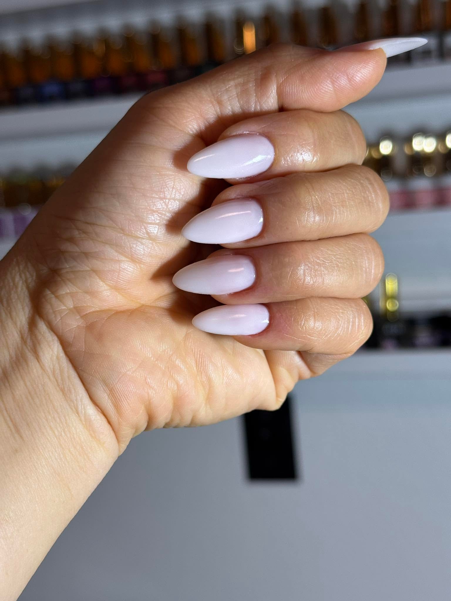Pale lilac-white glossy almond nails