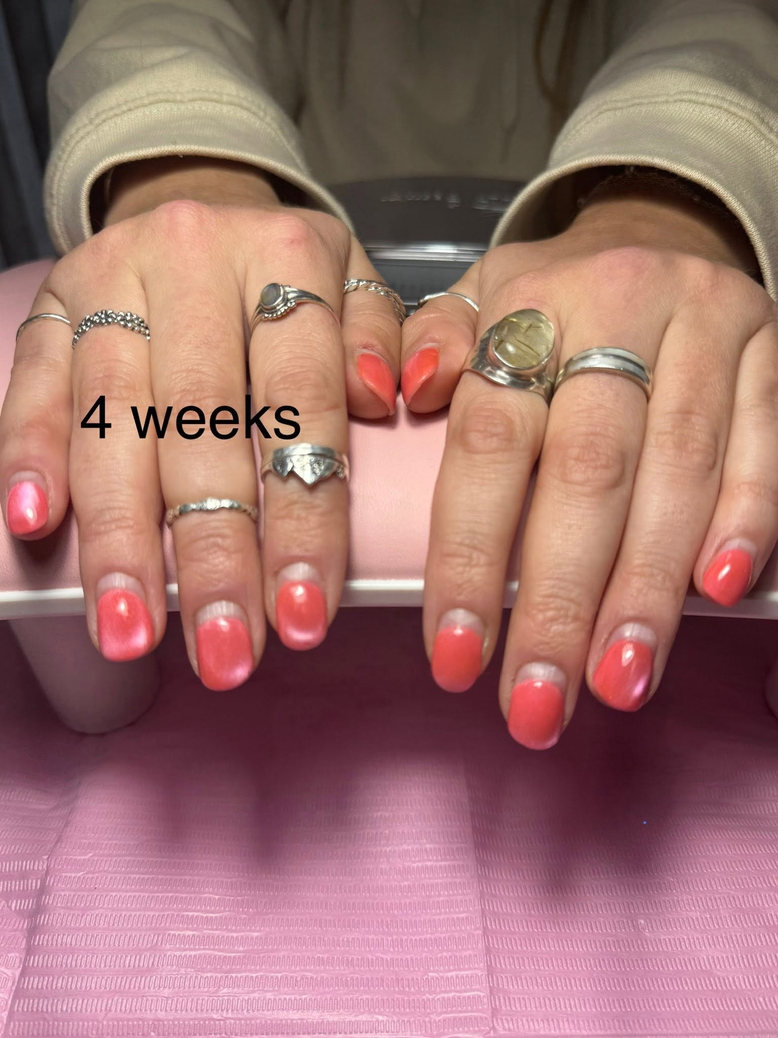Coral pink glossy gel manicure
