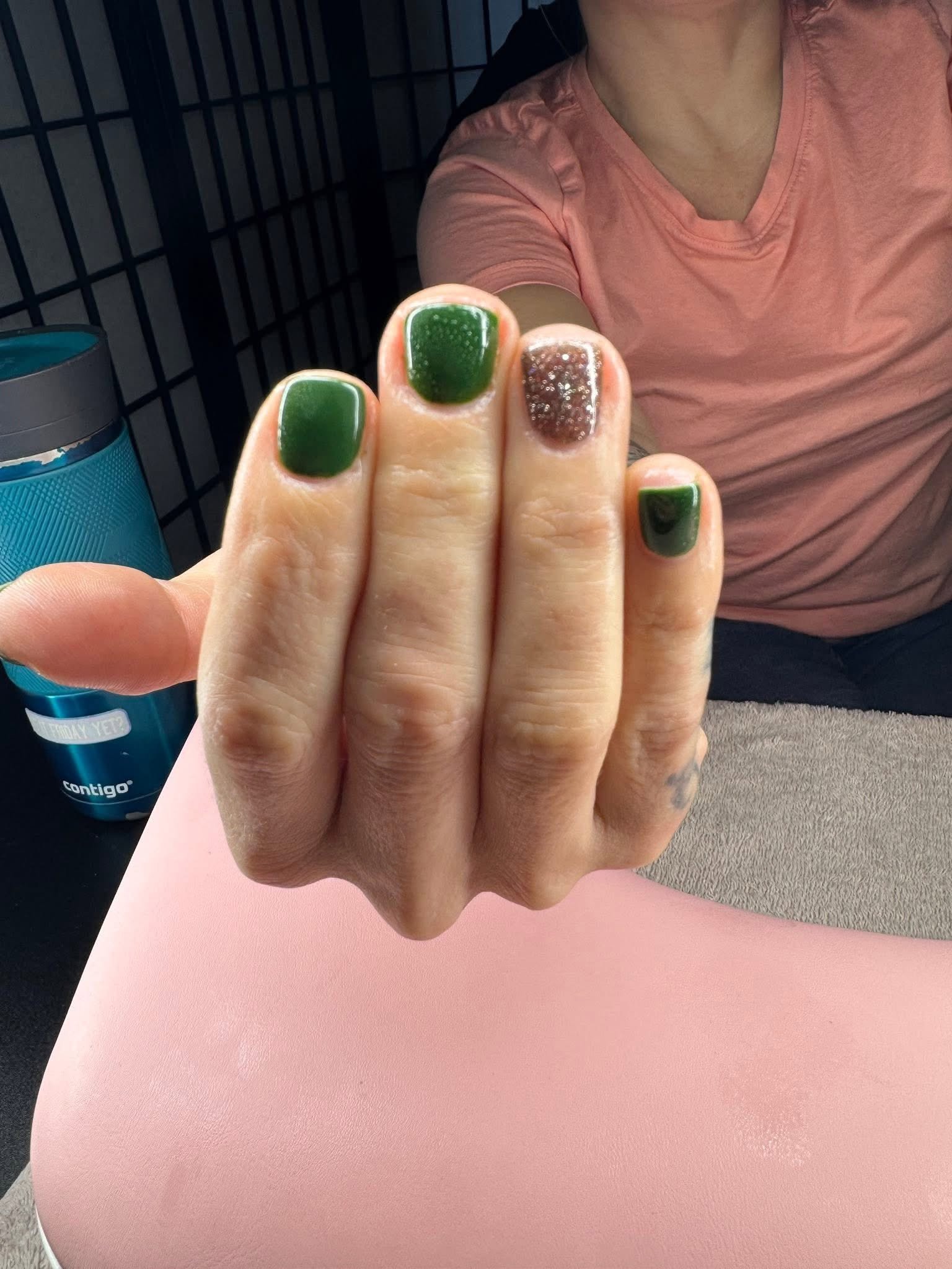Forest green glossy nails with a glitter accent nail