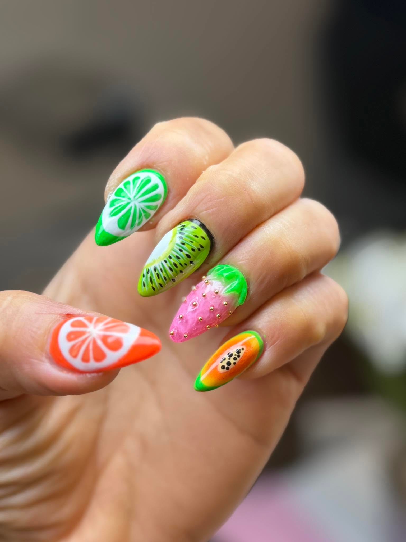 Colorful hand-painted tropical fruit nail art