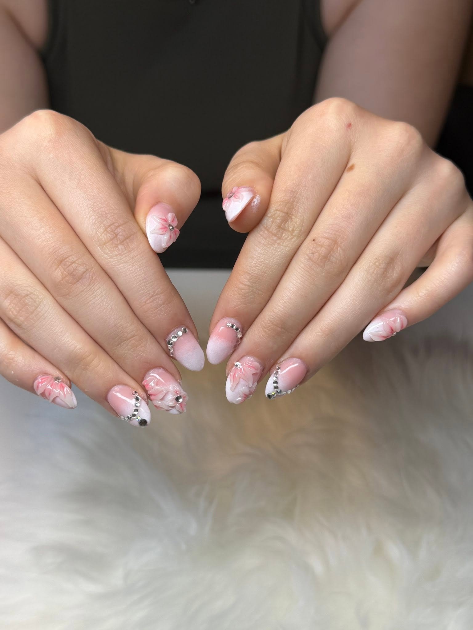 Elegant 3D floral nail art with rhinestone details