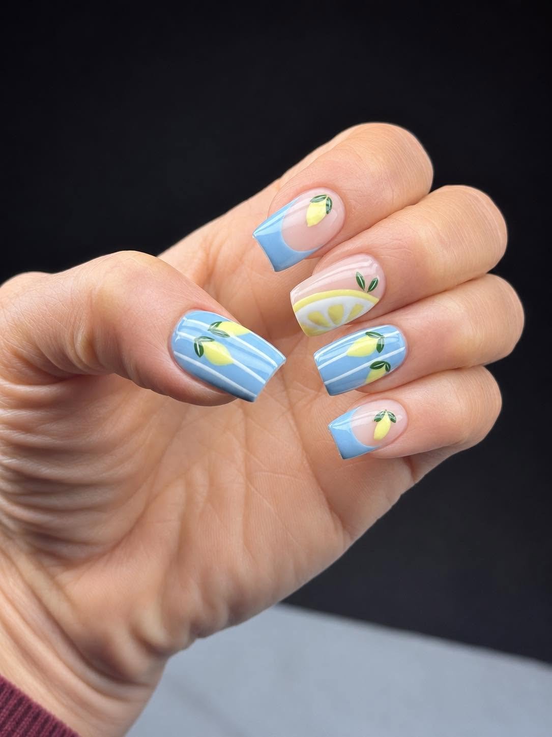 Blue French tips with hand-painted lemon slice design