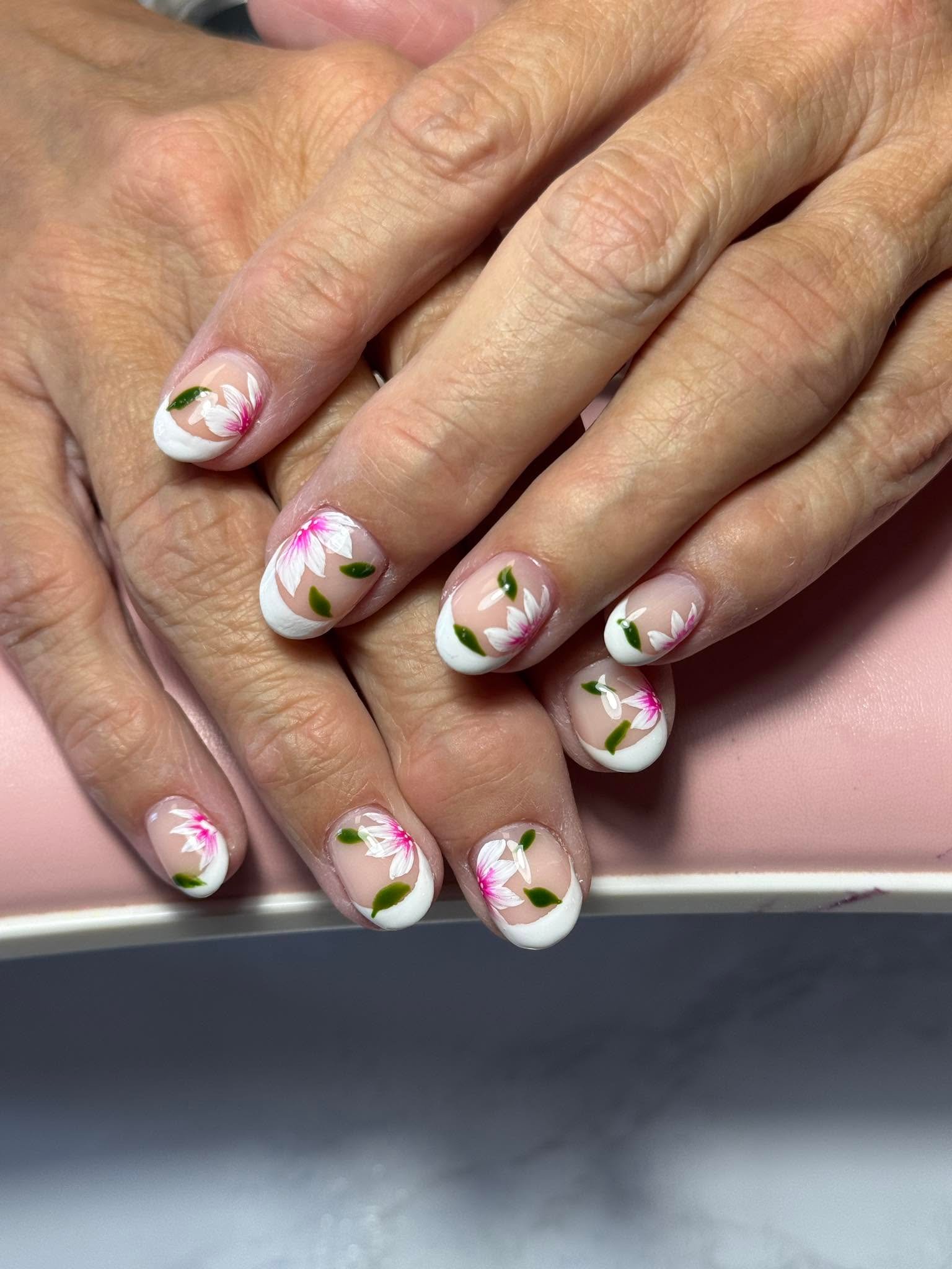 White French tips with hand-painted pink and white flowers