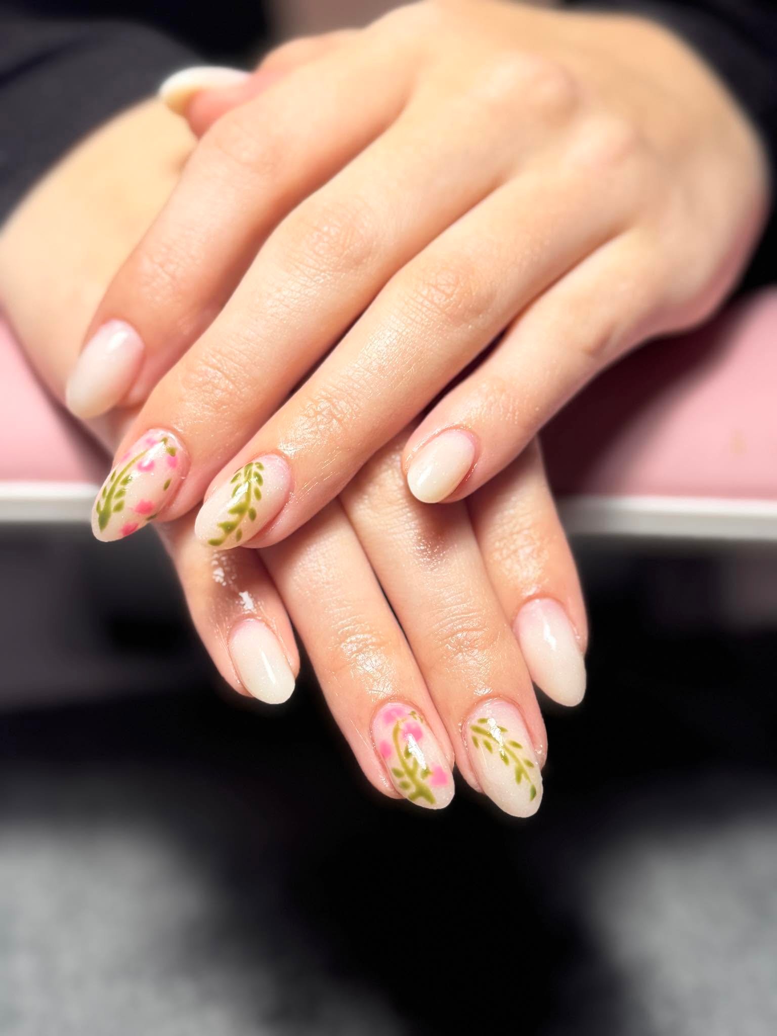 Sheer nude nails with pink and green floral vine nail art