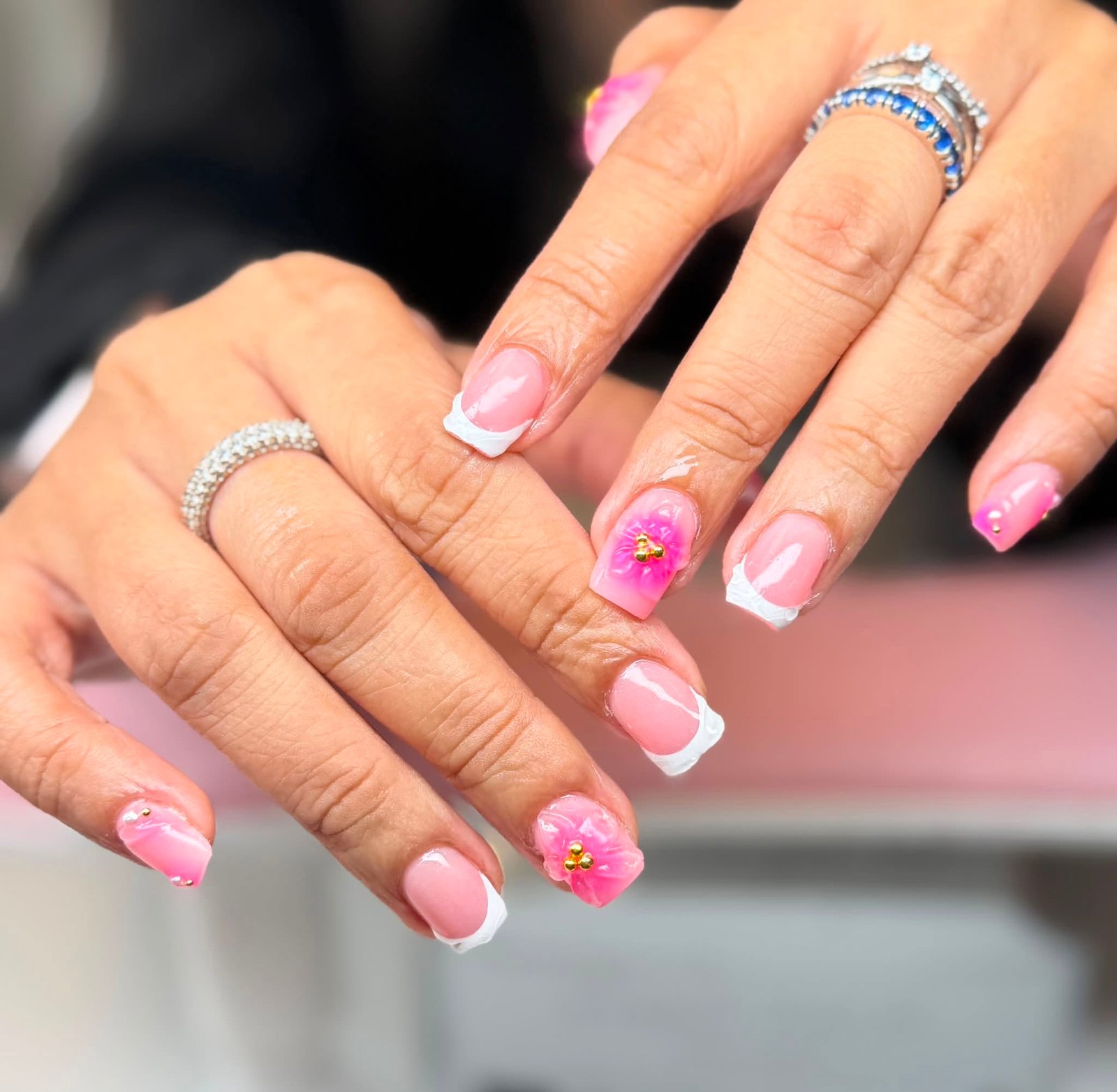 Pink French tips with 3D flower and gold beads