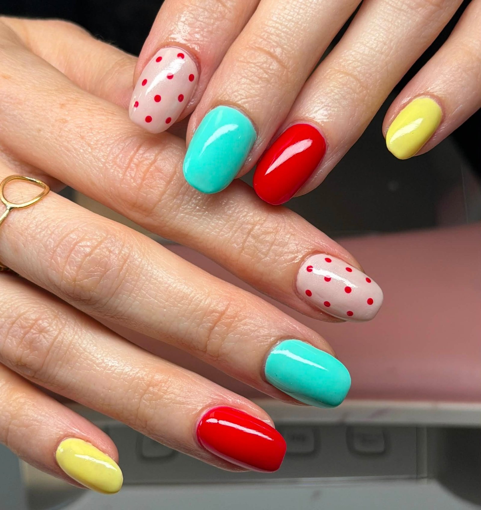 Multicolor manicure with polka dot accents