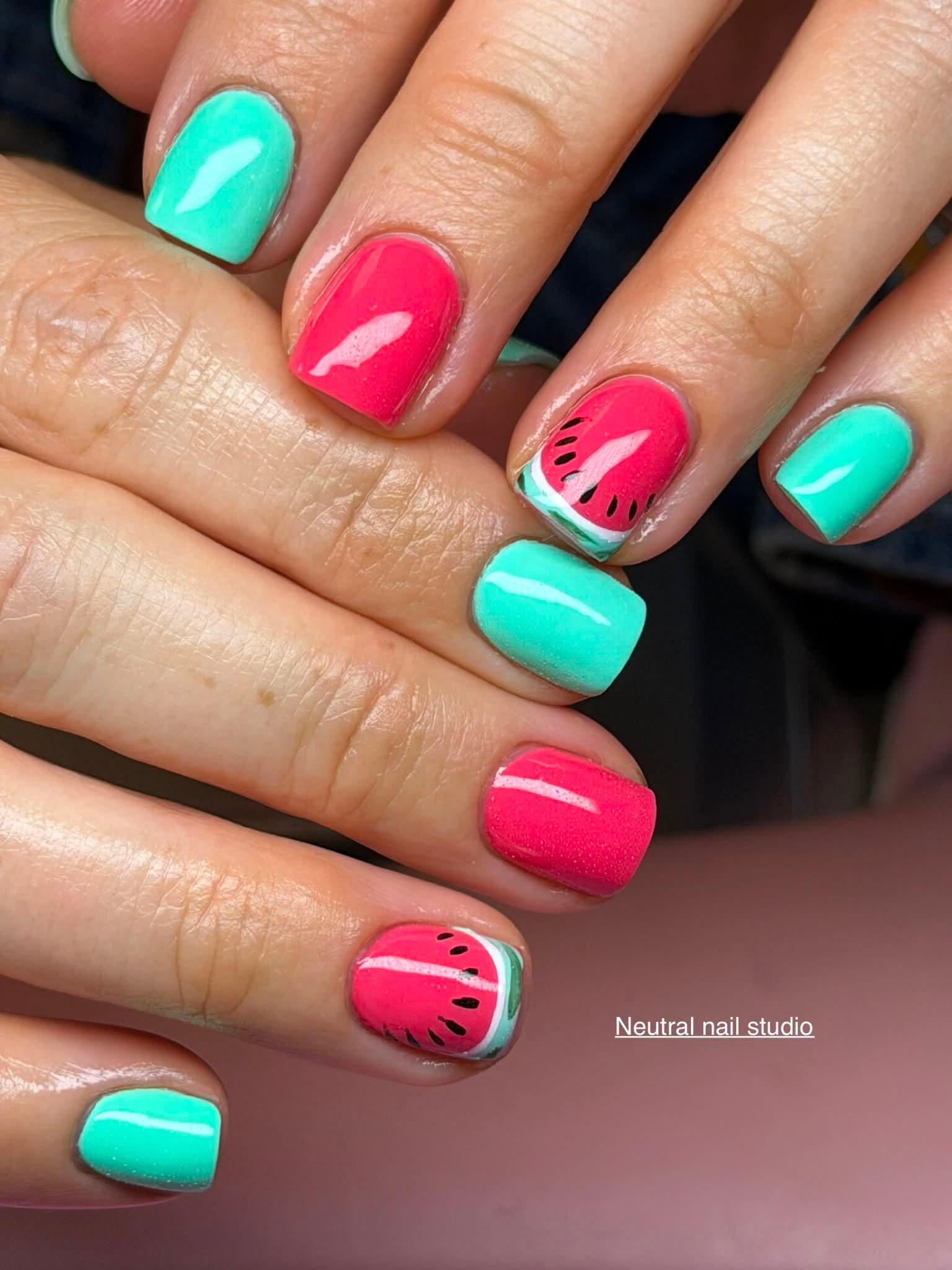 Mint and coral manicure with watermelon design