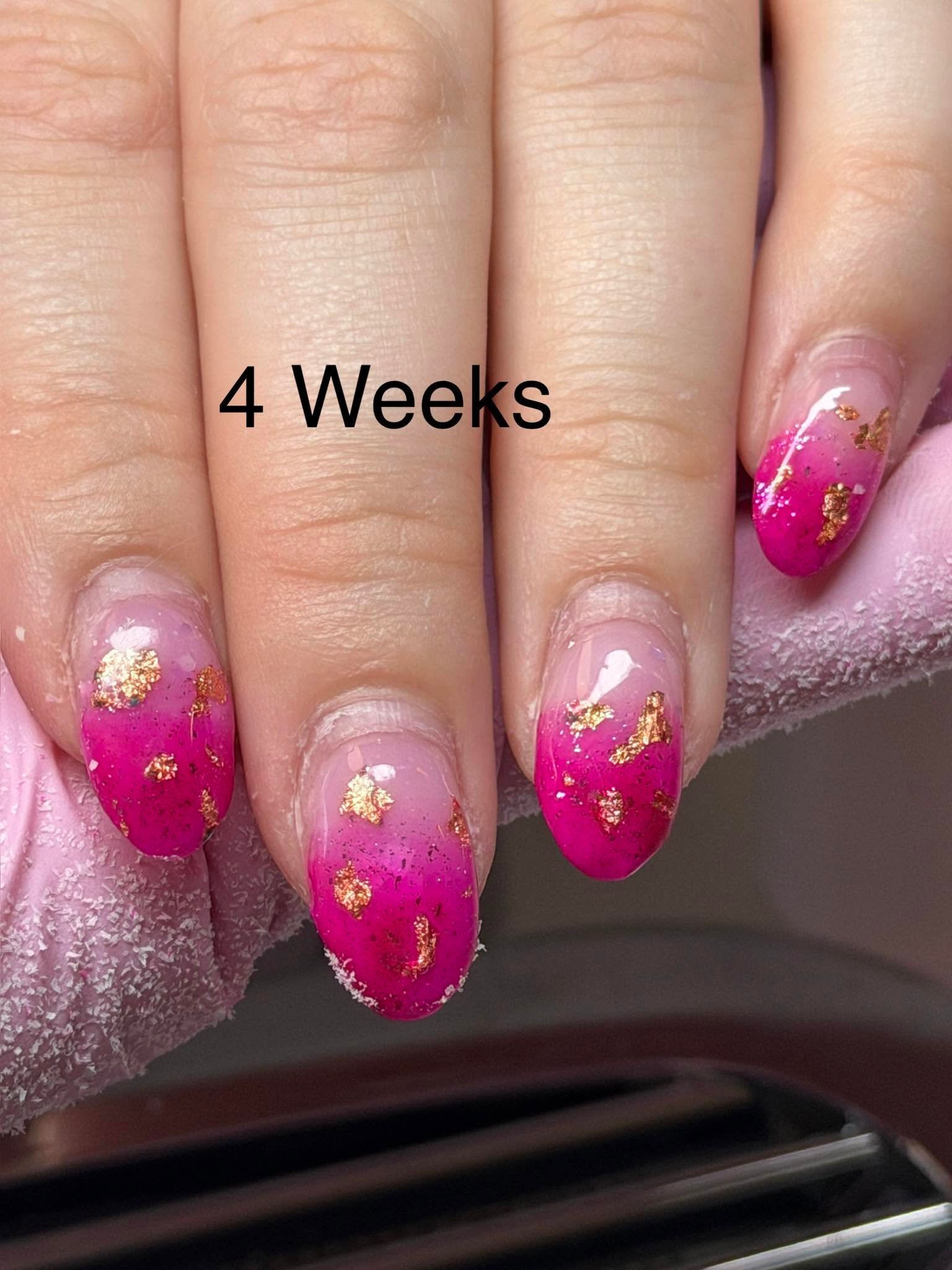 Pink ombre nails with gold foil flakes