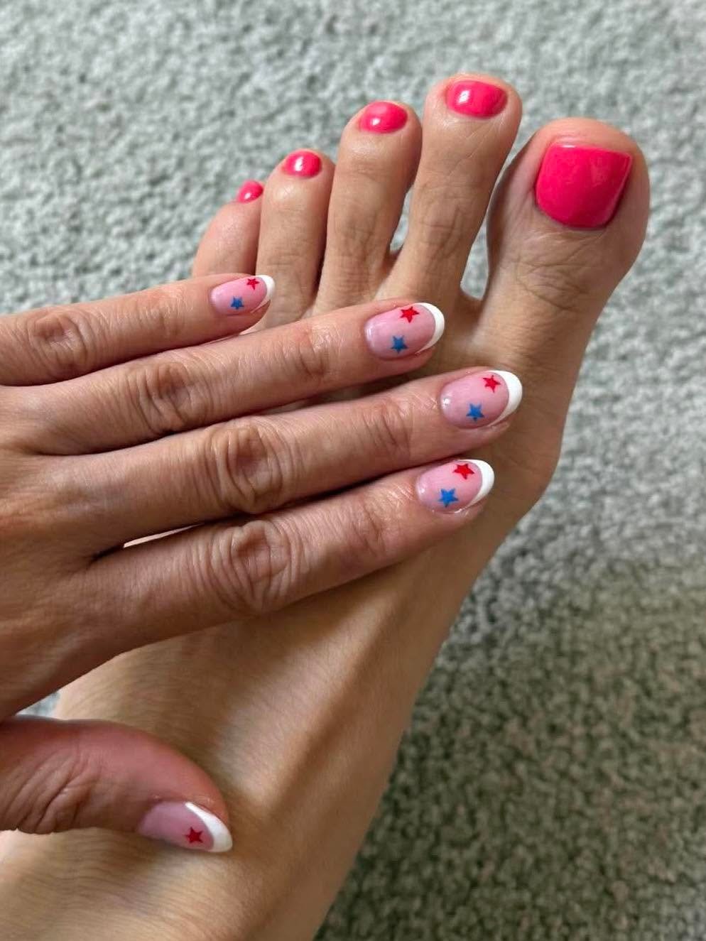 Pink pedicure with red and blue star accent toes